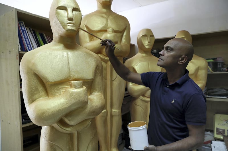 Dubai, United Arab Emirates - January 10th, 2018: Photo project. Sculptor Mark Ranasinghe applies the final touches to his giant oscar sculptures made out of polystyrene. Wednesday, January 10th, 2018 at Al Quoz, Dubai. Chris Whiteoak / The National