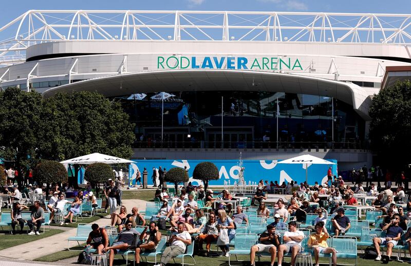 Fans relax outside the Rod Laver Arena at Melbourne Park during the Australian Open. Reuters