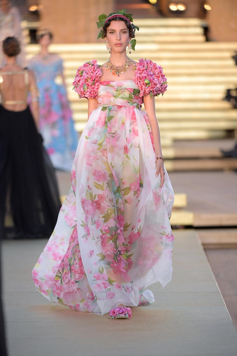A floral dress with capped sleeves made of three-dimensional blooms. Courtesy Dolce & Gabbana