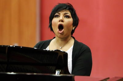Kuwaiti opera singer Amani Hajji, practices at the Higher Institute for Musical Arts in Kuwait City on April 12, 2018. 
Hajji, Kuwait's first opera singer with a small but dedicated local following, has for the past 20 years refused to give up on her dream of making opera mainstream in her native Kuwait. / AFP PHOTO / YASSER AL-ZAYYAT