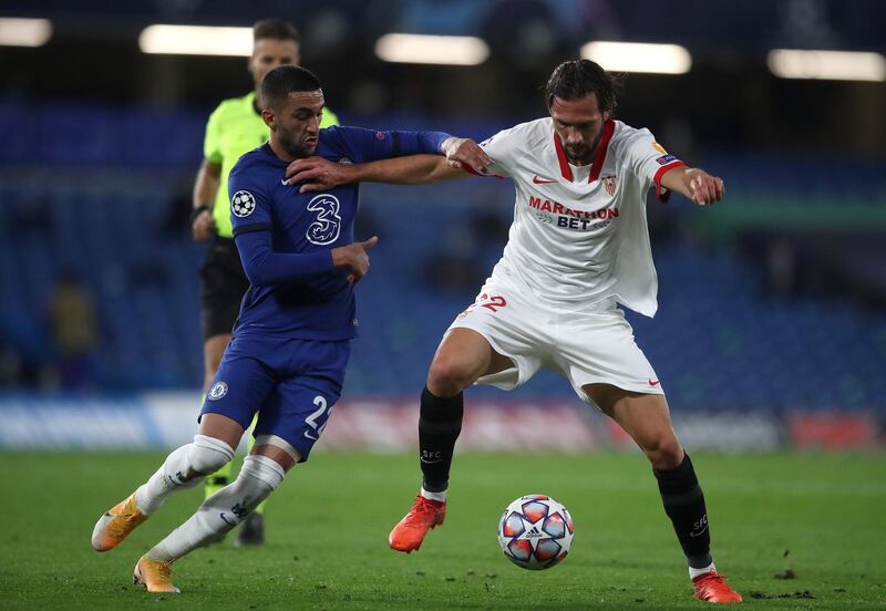 Franco Vazquez of Sevilla holds off Chelsea's Hakim Ziyech. Getty