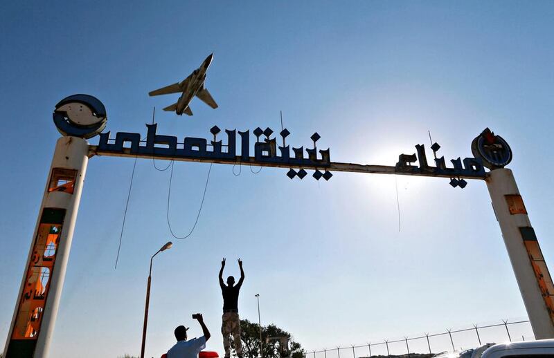 An aircraft flies over the entrance to an oil terminal in Zueitina, west of Benghazi, Libya, on September 14, 2016. Esam Omran Al Fetori / Reuters