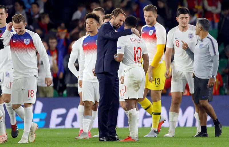 epa07095911 England's head coach Gareth Southgate (C-L) talks to player Raheem Sterling (C-R) after the UEFA Nations League soccer match between Spain and England at Benito Villamarin stadium in Seville, southern Spain, 15 October 2018.  EPA/JULIO MUNOZ