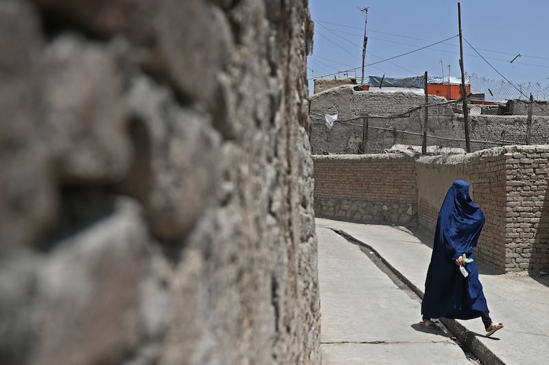 An Afghan woman in an alley in Kabul's old quarter.