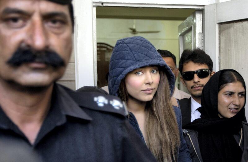 Pakistan's top model, Ayaan Ayaan Ali, center, leaves a court in Rawalpindi, Pakistan, Monday, June 1, 2015. Ali is under detention since her midnight arrest on March 14 at Islamabad airport and faces money laundering charges after authorities seized over $500,000 before she boarded a Dubai-bound flight. Pakistani law makes it illegal��for a passenger��carry over $10,000 on��a flight. (AP Photo/B.K. Bangash)