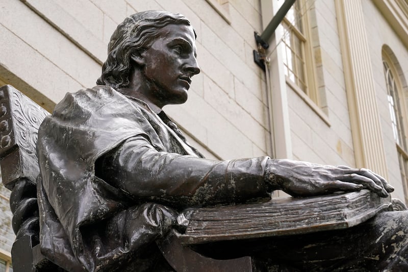 The statue of John Harvard, founder of Harvard College, is seen at Harvard Yard in Cambridge, Massachusetts. AP