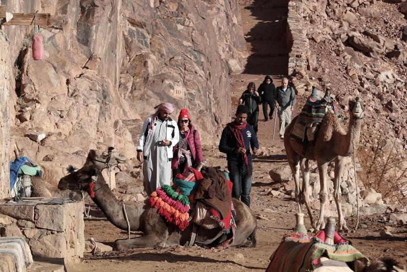 Tourists make their way down towards the monastery of Saint Catherine, after watching the sunrise on top of Mount Sinai. EPA