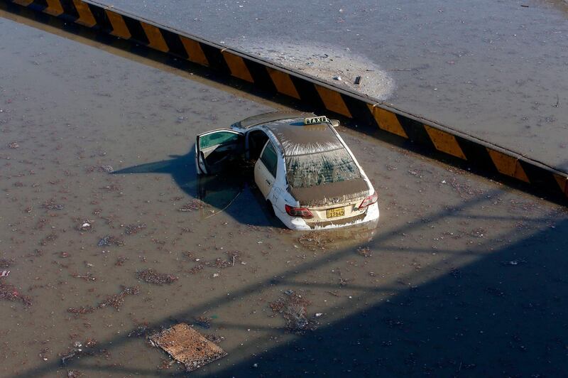 A car is seen stranded in a flooded underpass in Kuwait City. AFP