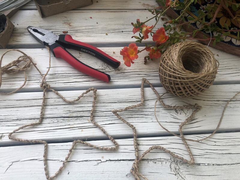 Once you've wrapped wire around the nails, use pliers to define the shape. Photo: Pillarboxblue.com