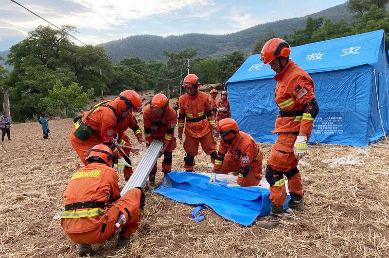 Emergency workers set up tents for people displaced by an earthquake in Yangbi county, near the tourist city of Dali , in China's south-western Yunnan province. AFP