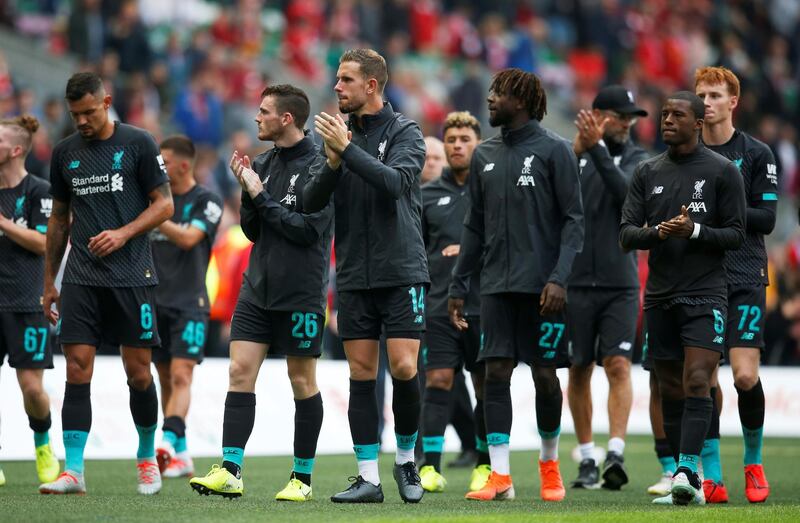 Liverpool players applaud the fans after the match. Reuters