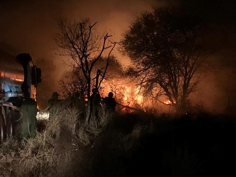 Wildfire is seen in Tsavo West National Park, Mwaktau, Kenya, in this handout photo taken between August 8 and 9, 2020. SHELDRICK WILDLIFE TRUST/Handout via REUTERS THIS IMAGE HAS BEEN SUPPLIED BY A THIRD PARTY. MANDATORY CREDIT. NO RESALES. NO ARCHIVES. NO USE AFTER SEPTEMBER 10, 2020.