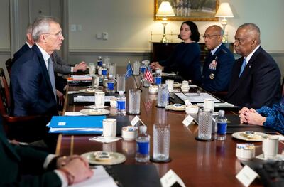 Nato Secretary General Jens Stoltenberg, left, meets US Defence Secretary Lloyd Austin, right, at the Pentagon on Monday. AFP 