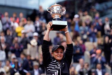 Australia's Ashleigh Barty poses with the trophy after winning the 2019 French Open in Paris. AFP