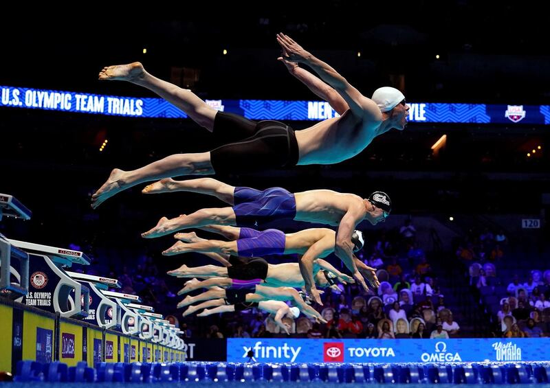 Competitors dive off the starting block in the men's 50m Freestyle prelims during the US Olympic swimming trials at CHI Health Centre in Omaha, Nebraska, on Saturday, June 19. USA TODAY Sports