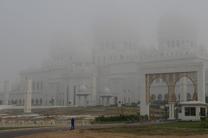 Sheikh Zayed Grand Mosque in Abu Dhabi is engulfed with thick fog on December 24, 2012. Ravindranath K / The National