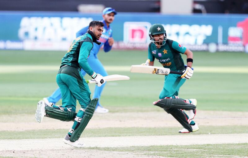 DUBAI , UNITED ARAB EMIRATES, September 19 , 2018 :- Left to Right – Shoaib Malik and Babar Azam of Pakistan running between the wickets during the Asia Cup UAE 2018 cricket match between Pakistan vs India held at Dubai International Cricket Stadium in Dubai. ( Pawan Singh / The National )  For Sports/Instagram. Story by Paul 