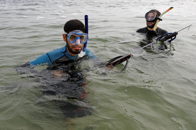 Palestinian spear-fisherman Ashraf Al-Amoudi prepares to dive underwater at the Mediterranean Sea off the coast of the southern Gaza Strip.   Reuters
