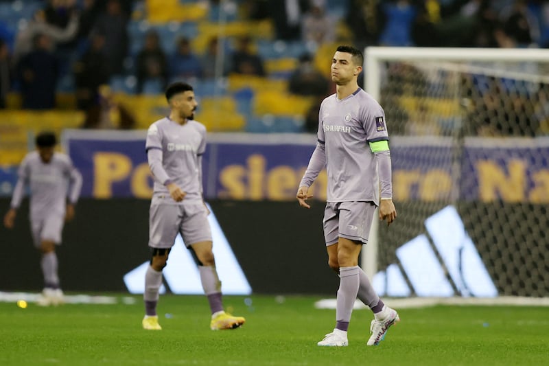 Cristiano Ronaldo of Al Nassr reacts to Al Ittihad's third goal. Getty Images