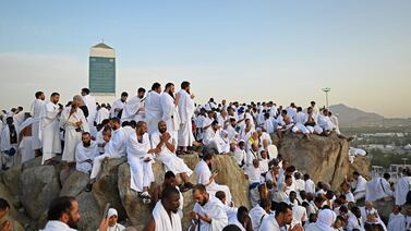 Muslim pilgrims pray on top of Saudi Arabia's Mount Arafat during Hajj. AFP