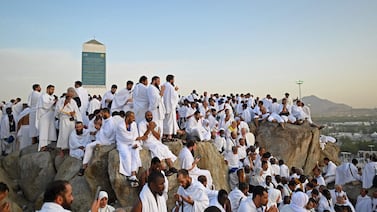Muslim pilgrims pray on top of Saudi Arabia's Mount Arafat during Hajj. AFP