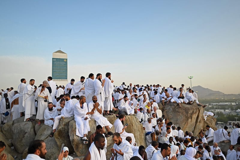 Muslim pilgrims pray on top of Saudi Arabia's Mount Arafat during Hajj. AFP
