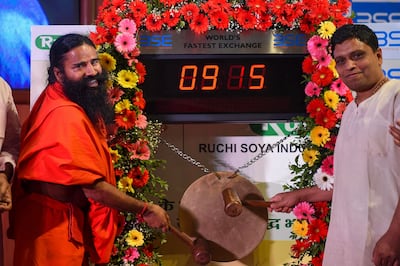 Indian yoga guru Baba Ramdev, left, and Patanjali Ayurveda managing director Acharya Balkrishna tendered their apology to the Supreme Court in a contempt of court case. AFP