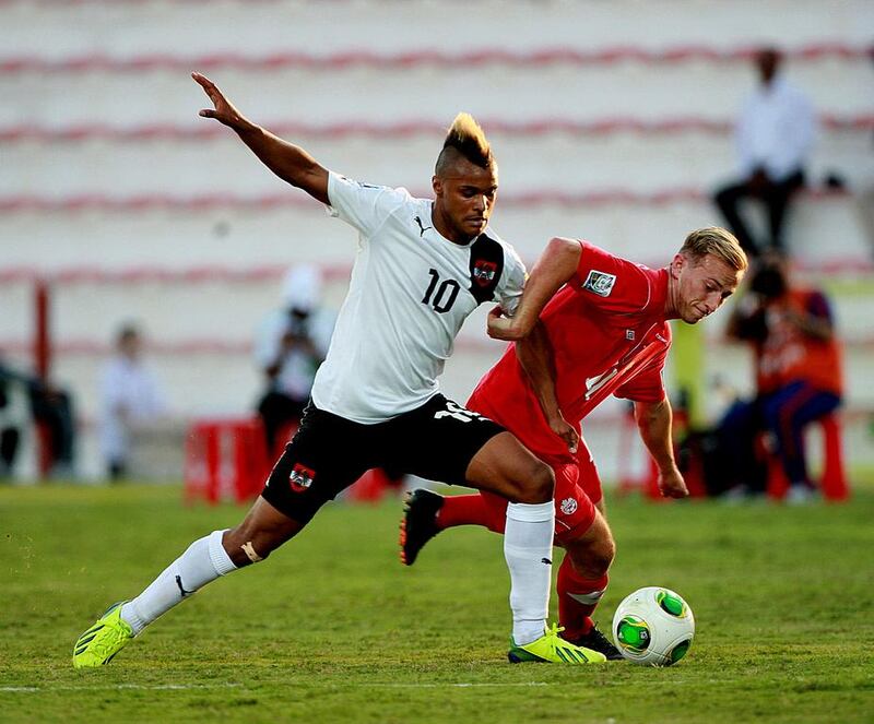 Valentin Lazaro of Austria, left, and Jordan Haynes of Canada strive for possession at the Rashid Stadium in Dubai. Satish Kumar / The National