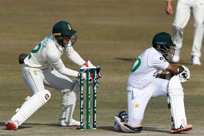 South Africa captain and wicketkeeper Quinton de Kock catches out Pakistan's Abid Ali for 13, off the bowling of Keshav Maharaj. AFP