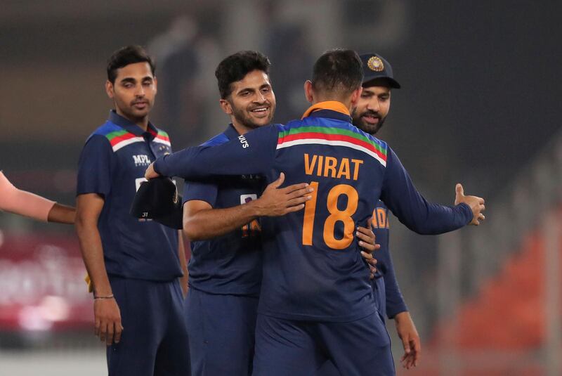 India players celebrate after beating England by eight runs in the fourth T20  match in Ahmedabad on Thursday, March 18. AP