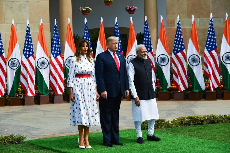India's Prime Minister Narendra Modi greets US President Donald Trump and First Lady Melania Trump before a meeting at Hyderabad House in New Delhi. AFP