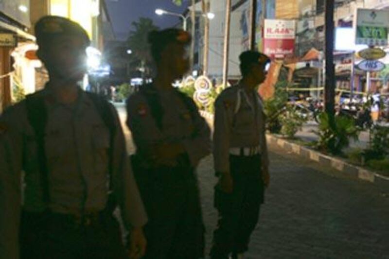 File photo: Police stand at the site of the blast in Bali in 2005.