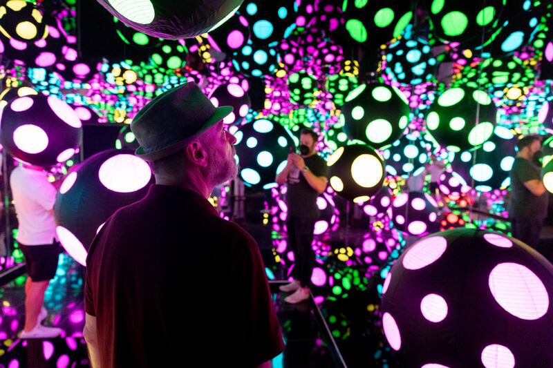 Visitors enter an infinity mirror room entitled 'My Heart is Dancing into the Universe', part of the exhibition One with Eternity, featuring the work of Yayoi Kusama, at the Hirshhorn Museum in Washington, DC. EPA