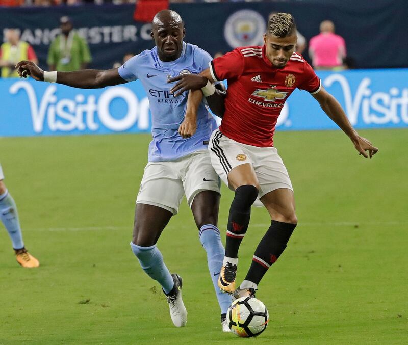 Manchester United's Andreas Pereira, right, and Manchester City's Eliaquim Mangala, left, battle for the ball during the second half of an International Champions Cup soccer match in Houston, Thursday, July 20, 2017. (AP Photo/David J. Phillip)