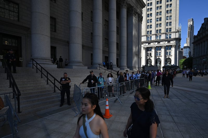Spectators wait to enter the US District Court for the Southern District of New York. AFP