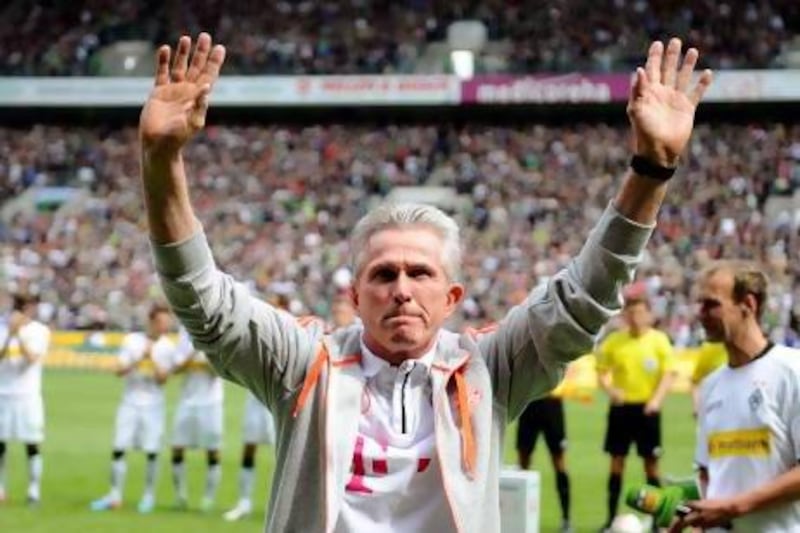 Bayern Munich’s coach Jupp Heynckes waves to acknowledge well-deserved cheers. In his return to Bayern for a third stint he has led them to the domestic league title and Uefa Champions League final.