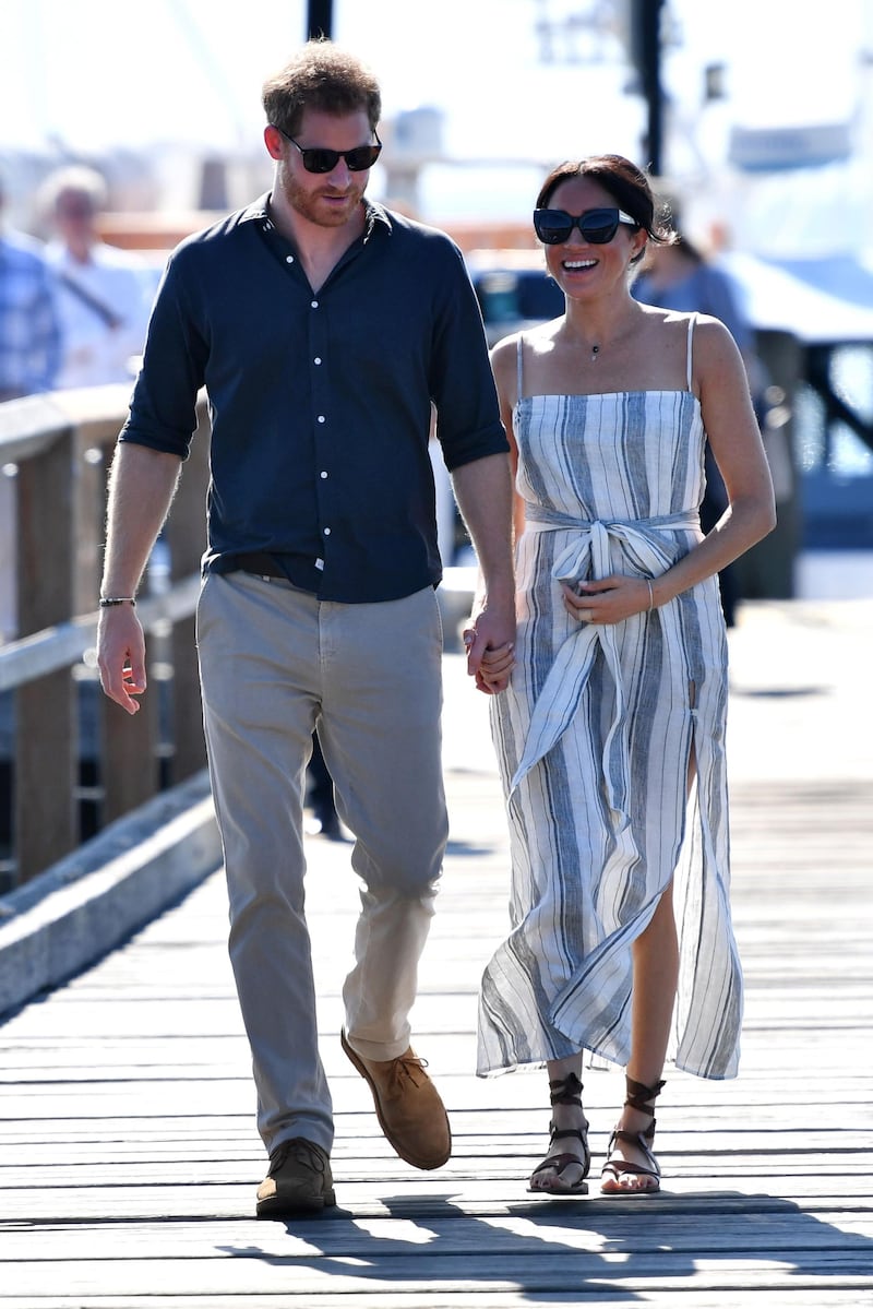 Meghan and Harry walk down the wharf. Getty Images
