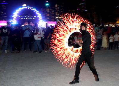 A performer entertains the crowds at the official opening of Ain Dubai  