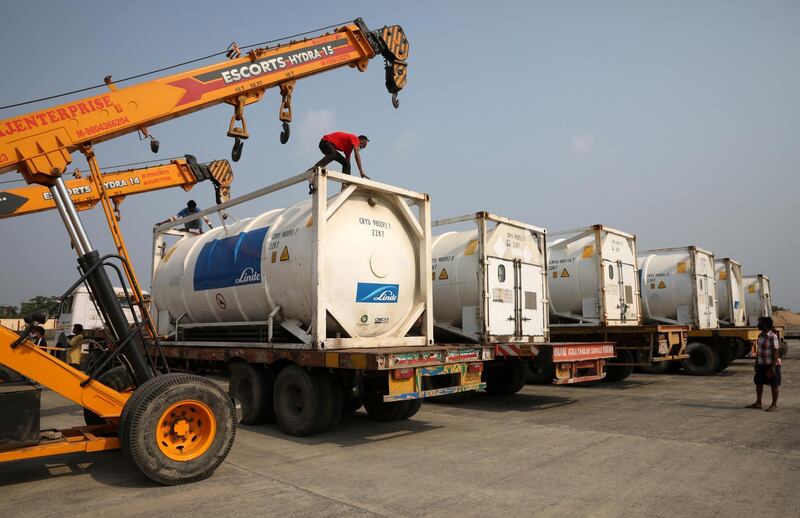 Liquid oxygen tankers arrive at at Netaji Subhas Chandra Bose International Airport in Kolkata. They are used to refill portable cylinders that can help patients to breathe. Reuters