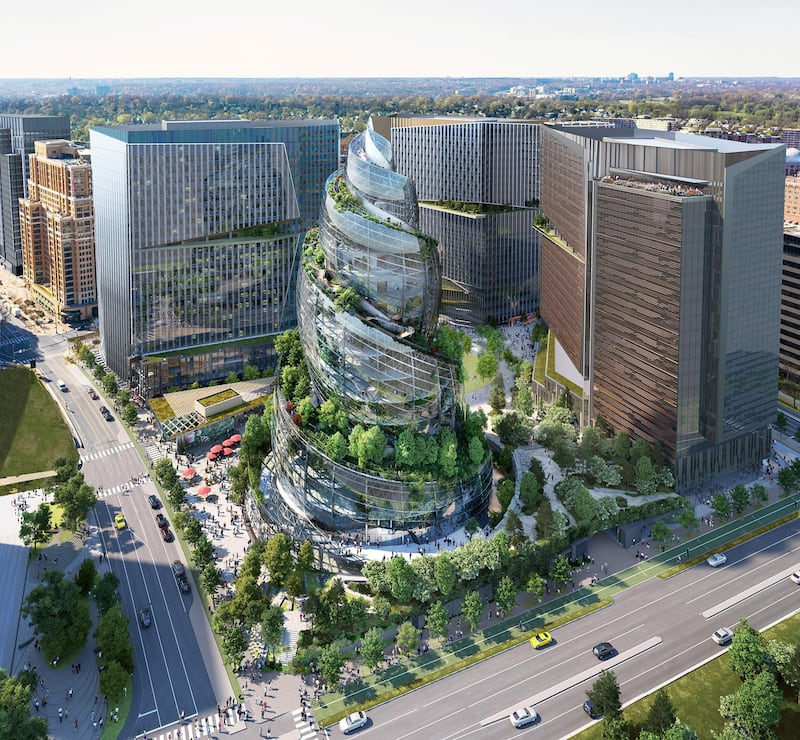 This artist rendering provided by Amazon shows the next phase of the company's headquarters redevelopment to be built in Arlington, Va. The plans released Tuesday, Feb. 2, 2021, features a 350-foot helix-shaped office tower that can be climbed from the outside like a mountain hike. (NBBJ/Amazon via AP)