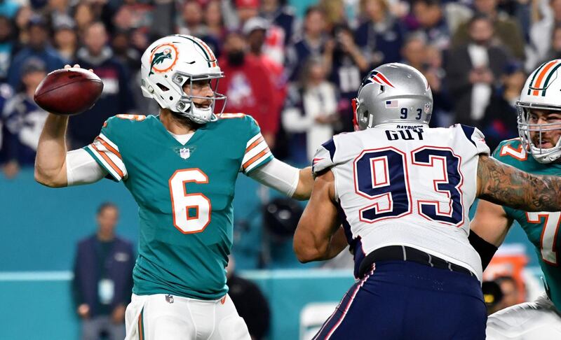 Dec 11, 2017; Miami Gardens, FL, USA; Miami Dolphins quarterback Jay Cutler (6) throws a pass as New England Patriots defensive end Lawrence Guy (93) applies pressure during the first half at Hard Rock Stadium. Mandatory Credit: Steve Mitchell-USA TODAY Sports