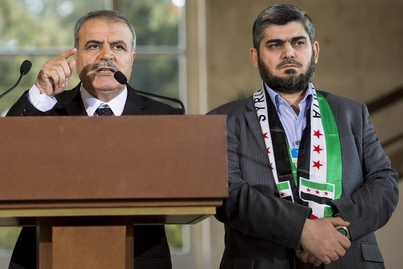 Asaad Al Zoubi (L), head of the opposition High Negotiations Committee (HNC), speaks at a press conference alongside the HNC's chief negotiator, Mohammed Alloush, at the European headquarters of the United Nations in Geneva on March 22, 2016. Jean-Christophe Bott/EPA 
