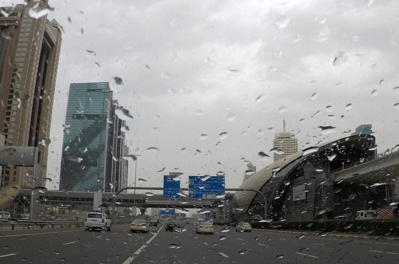 DUBAI , UNITED ARAB EMIRATES , March 17 – 2019 :- Traffic during the rain on Sheikh Zayed road in Dubai. ( Pawan Singh / The National ) For News. 