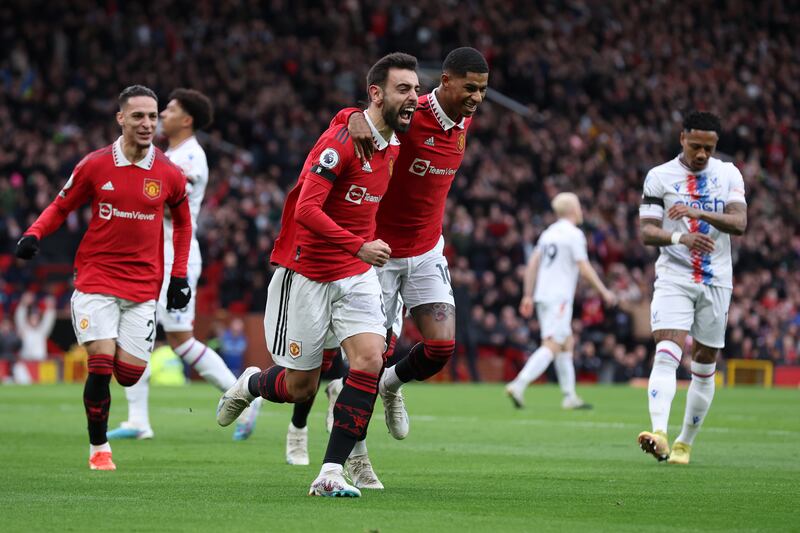 Manchester United's Bruno Fernandes celebrates with Marcus Rashford after scoring in the 2-1 win against Crystal Palace on February 4, 2023. Getty