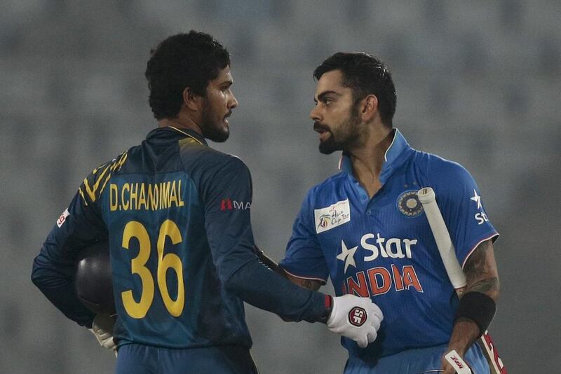 India’s Virat Kohli, right, is greeted by Sri Lanka’s wicketkeeper Dinesh Chandimal after India won their Asia Cup Twenty20 international cricket match in Dhaka, Bangladesh, Tuesday, March 1, 2016. (AP Photo/A.M. Ahad)