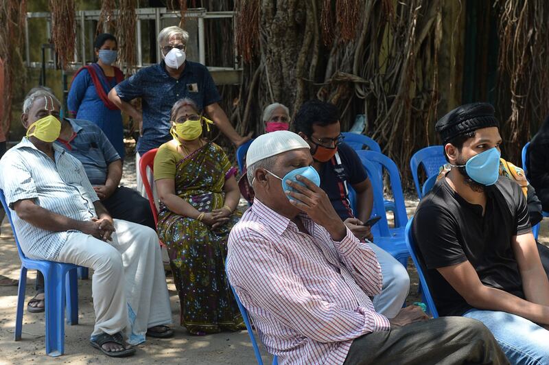 Residents wait at a Covid-19 testing centre in Chennai.   AFP
