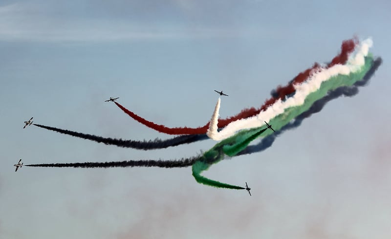 Members of the UAE Al Fursan aerobatics team perform during celebrations for the 50th UAE National Day. EPA
