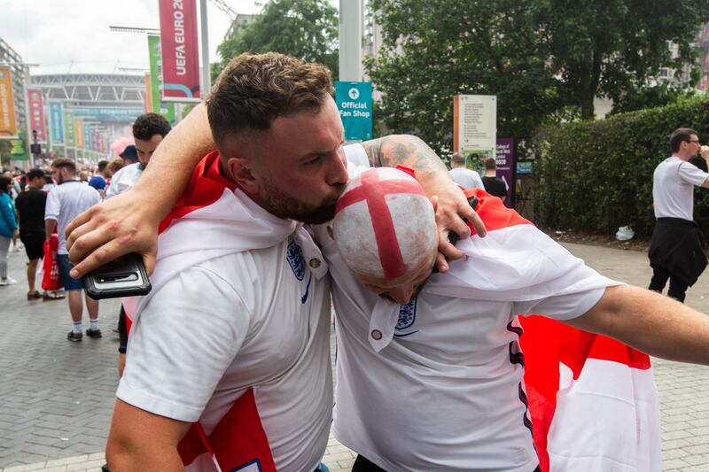 Fans arrive at Wembley stadium ahead of the Euros football final between England and Italy.