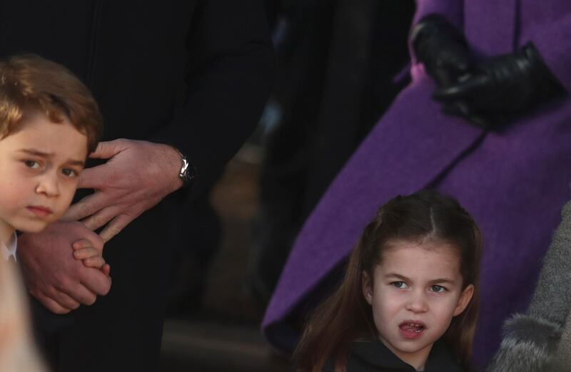Britain's Prince George and Princess Charlotte, children of the Duke and Duchess of Cambridge after attending a Christmas day service at the St Mary Magdalene Church. AP
