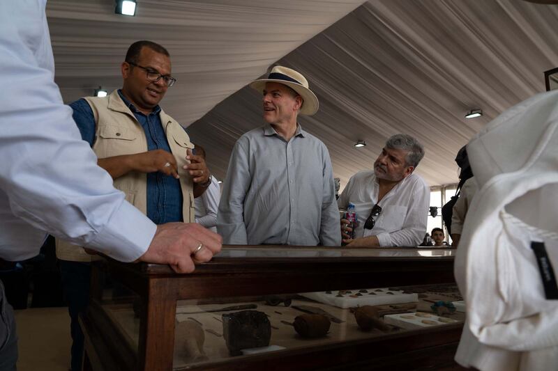 People at the event discuss new findings at the Saqqara necropolis